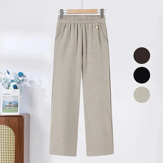 Pantalon uni, à jambes droites et élastique.