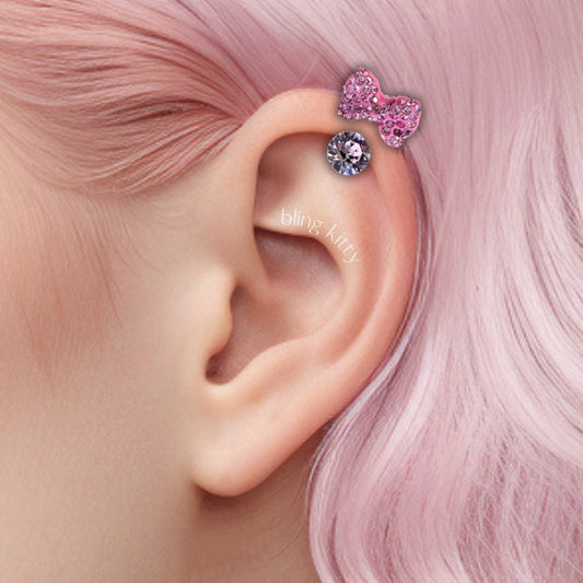 🎀✨ Ear Piercing with Pink Bow and Sparkling Crystal – Sweetness, Elegance, and Style! 💖💎